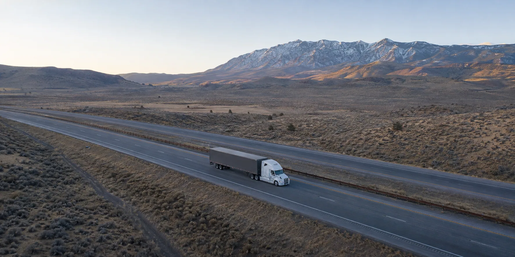 Unbranded tractor-trailer on a high-desert freight route near Carson City